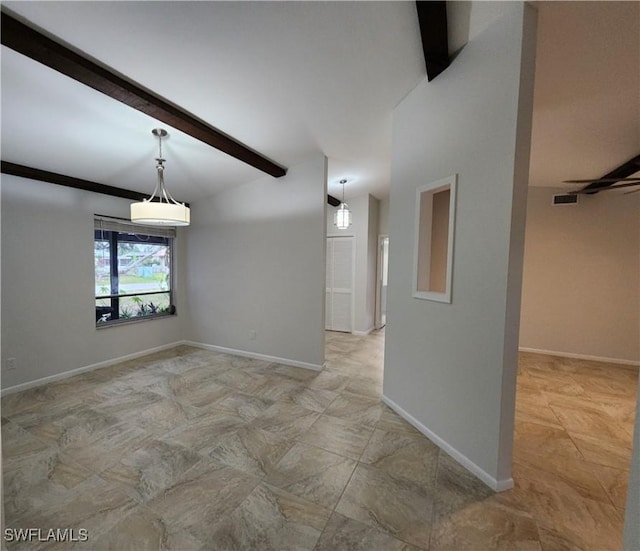 spare room featuring beam ceiling