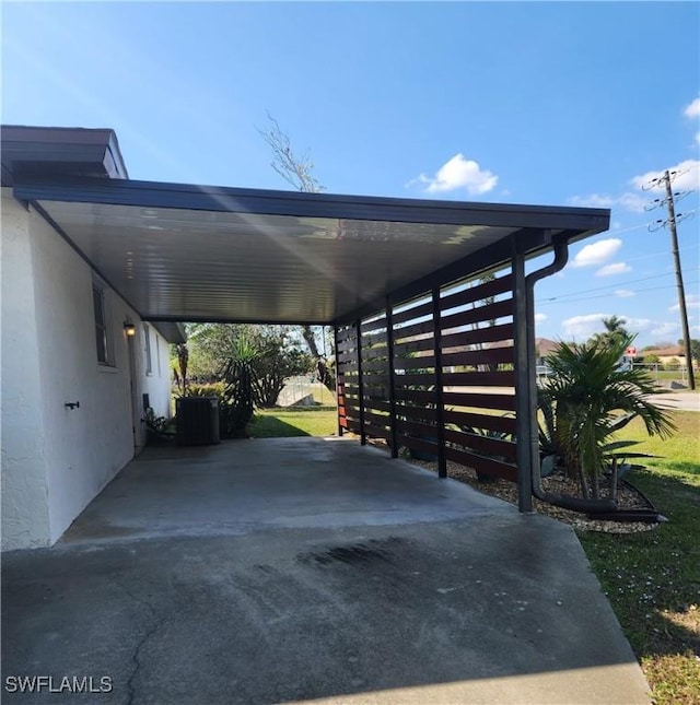 view of parking / parking lot with a carport