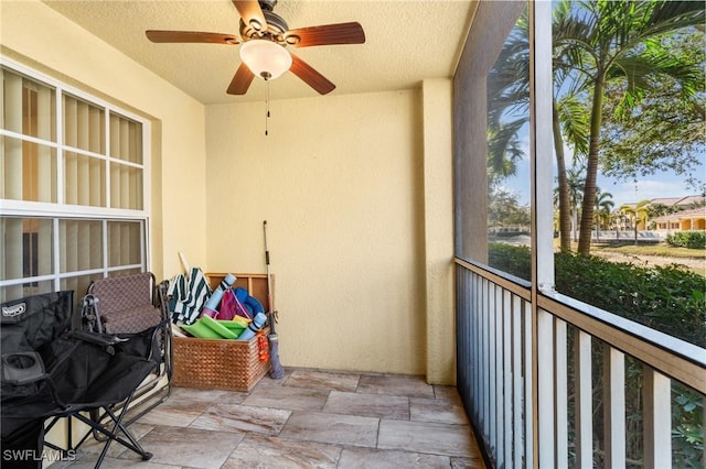 balcony featuring ceiling fan