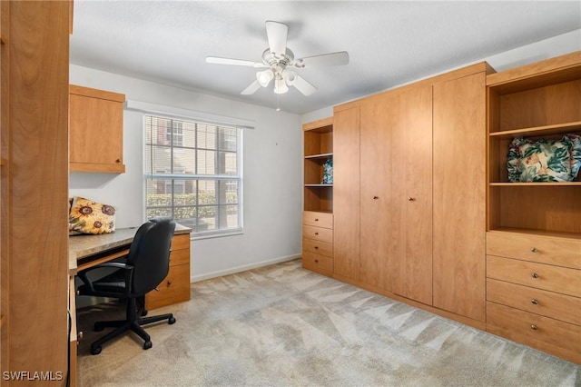 office with ceiling fan and light carpet