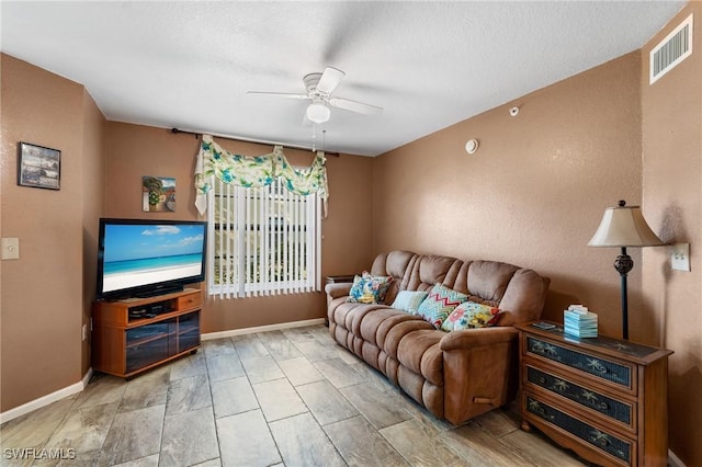 living room featuring ceiling fan