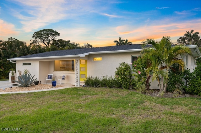 view of front of house with a lawn