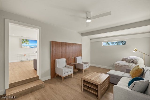 living room featuring ceiling fan and light wood-type flooring