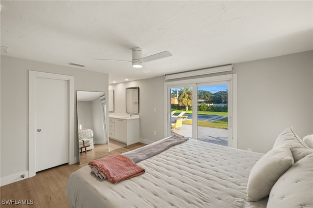 bedroom with connected bathroom, access to exterior, light hardwood / wood-style floors, and ceiling fan