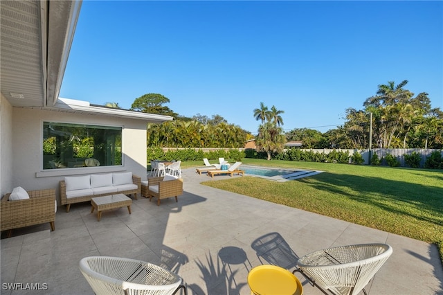 view of patio featuring a fenced in pool and outdoor lounge area