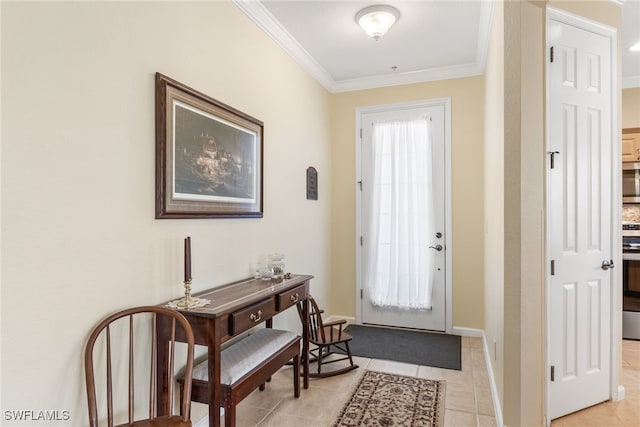 foyer featuring crown molding, baseboards, and light tile patterned floors