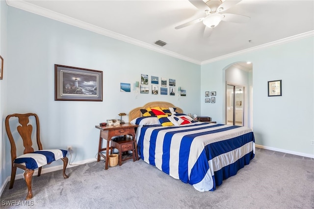 bedroom with carpet floors, baseboards, visible vents, and ornamental molding