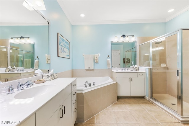 bathroom featuring a bath, a shower stall, ornamental molding, and a sink