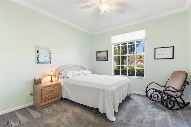 bedroom featuring ornamental molding, dark colored carpet, ceiling fan, and baseboards