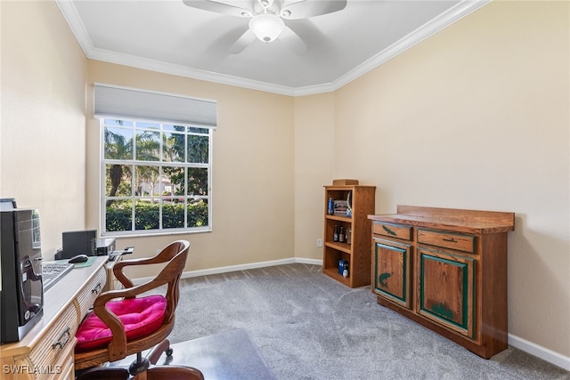 carpeted office space featuring a ceiling fan, baseboards, and crown molding