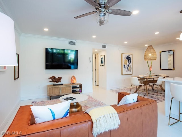 living room featuring ornamental molding and ceiling fan