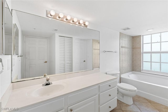 full bath featuring tile patterned floors, visible vents, toilet, a closet, and vanity