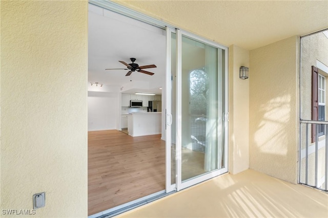 property entrance with stucco siding