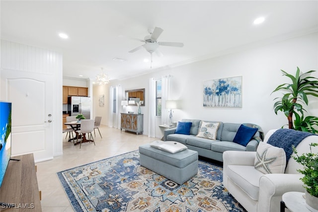 tiled living room with ornamental molding and ceiling fan