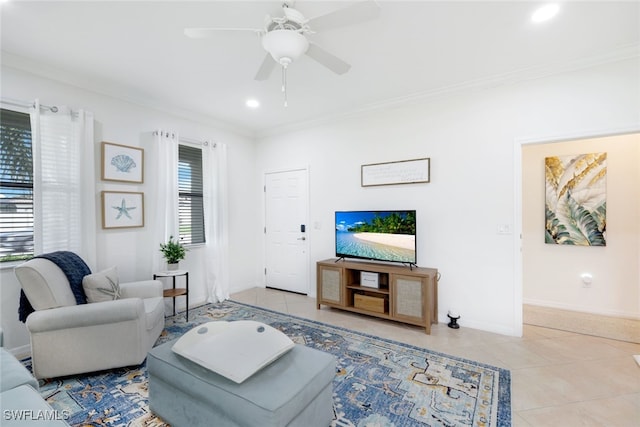 living room with ceiling fan, crown molding, a healthy amount of sunlight, and light tile patterned flooring