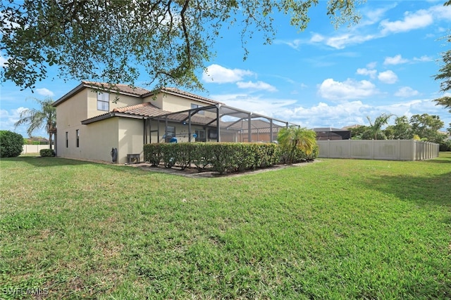 view of yard with a lanai