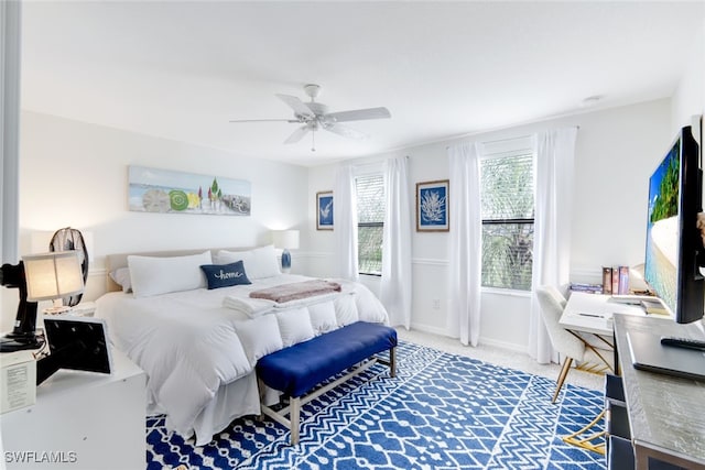 bedroom with ceiling fan and carpet flooring