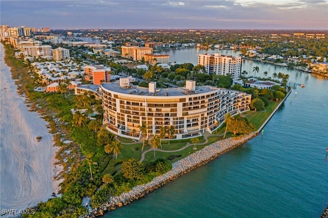 aerial view at dusk with a water view