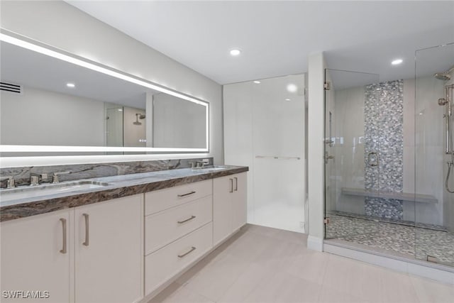 bathroom featuring vanity and walk in shower