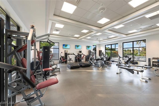 exercise room featuring a paneled ceiling