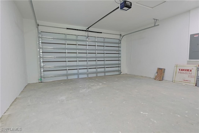 garage featuring a garage door opener and electric panel