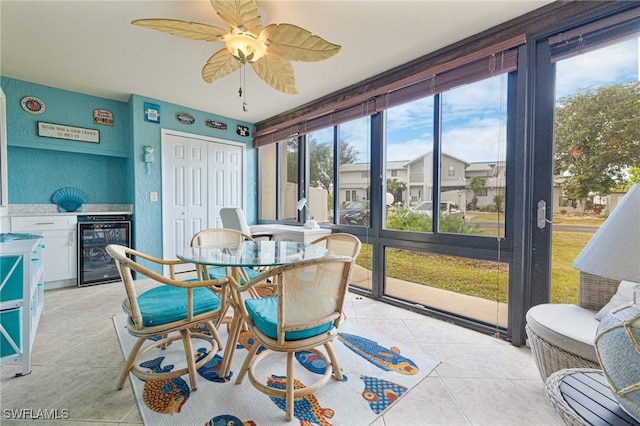 sunroom / solarium featuring wine cooler and ceiling fan