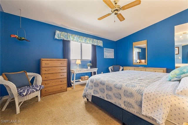 carpeted bedroom with lofted ceiling and ceiling fan