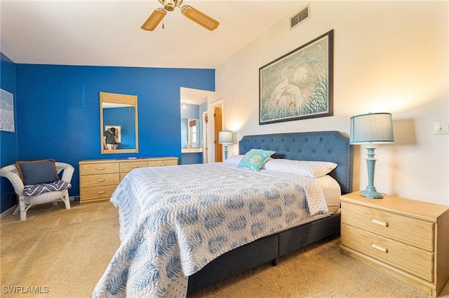 bedroom with ceiling fan and light carpet