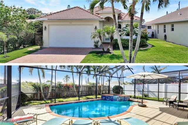 view of swimming pool featuring an in ground hot tub and a yard