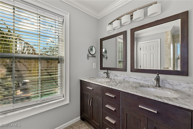 bathroom featuring ornamental molding and vanity