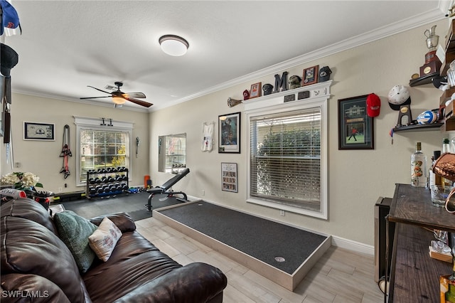 living room featuring crown molding, ceiling fan, light hardwood / wood-style flooring, and a textured ceiling