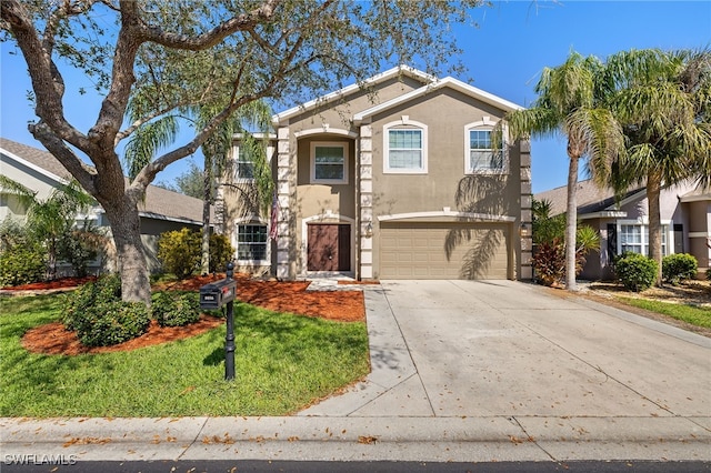 view of front of home with a garage and a front lawn