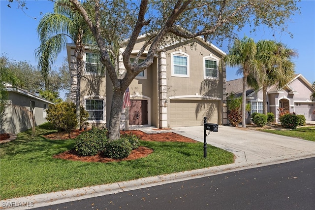 view of front of home with a garage and a front lawn