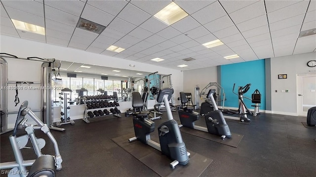 exercise room with a paneled ceiling