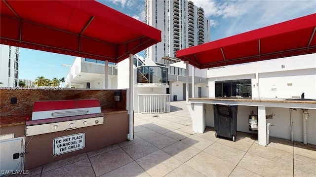 view of patio with a grill