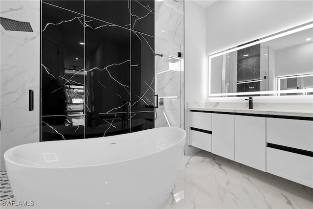 bathroom featuring vanity and shower with separate bathtub