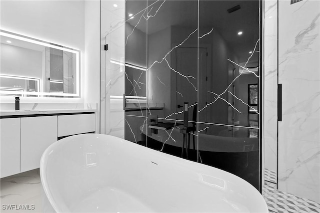 bathroom with a bathing tub and vanity