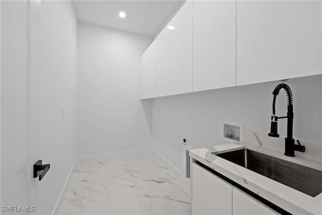 laundry room featuring cabinets, washer hookup, sink, and electric dryer hookup