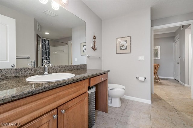 full bathroom featuring tile patterned flooring, toilet, a shower with shower curtain, vanity, and baseboards