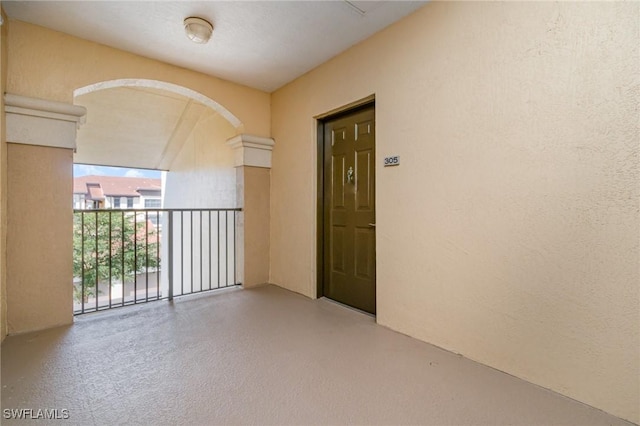 doorway to property featuring a balcony