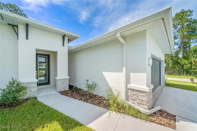 entrance to property featuring a garage