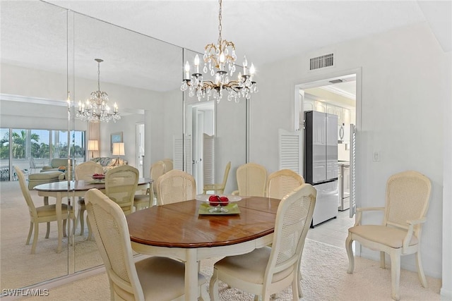 dining space with an inviting chandelier