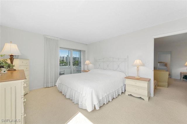 carpeted bedroom featuring access to outside