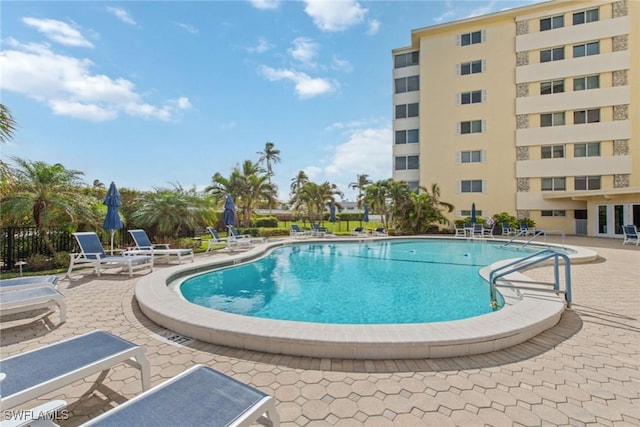 view of swimming pool featuring a patio area