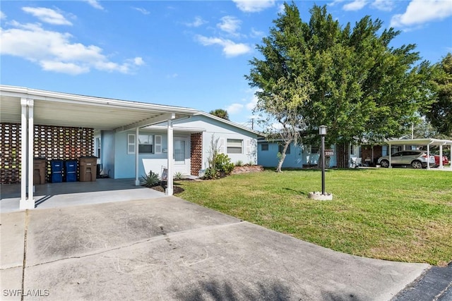 view of front facade featuring a front lawn and a carport