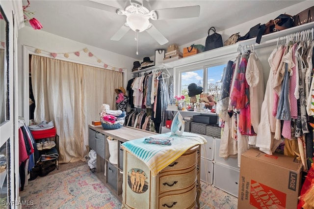 walk in closet with ceiling fan