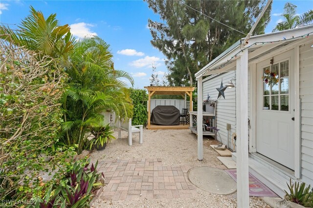 view of patio with a grill