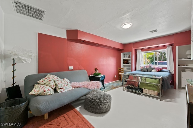 bedroom featuring a textured ceiling