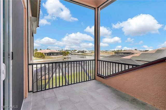 balcony featuring a water view