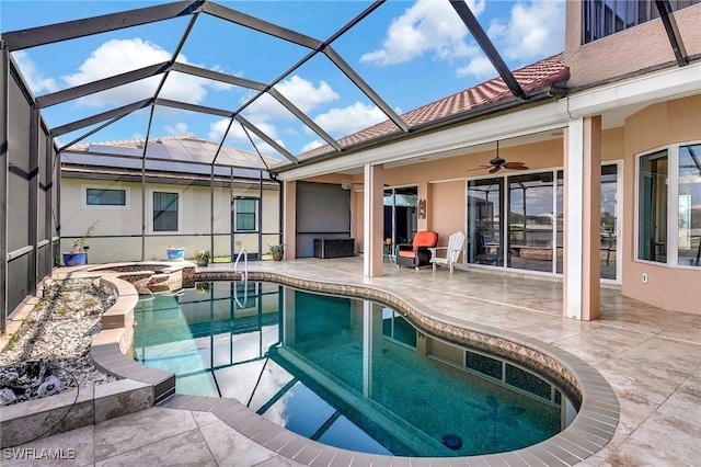 view of swimming pool featuring an in ground hot tub, a lanai, ceiling fan, and a patio